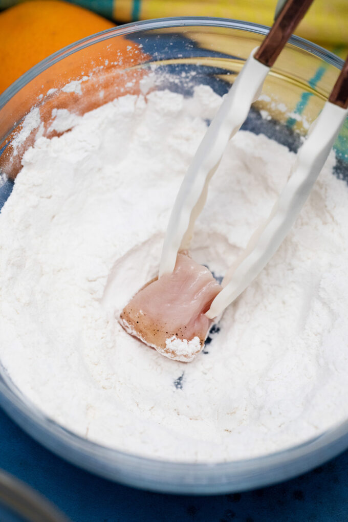 Toss chicken in flour and cornstarch.