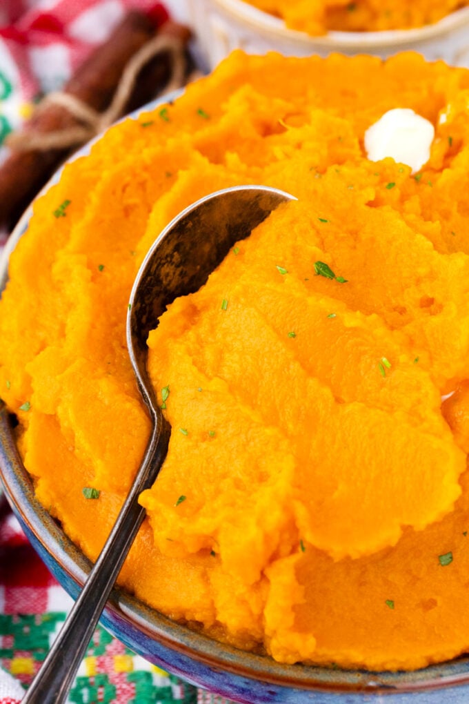 A bowl of creamy mashed sweet potatoes.