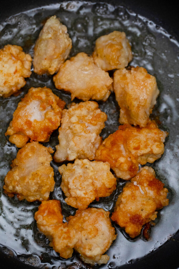 Fry chicken pieces.