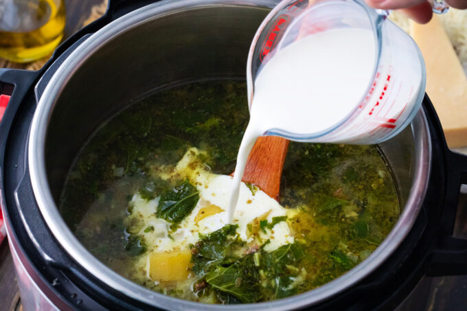 Adding cream to instant pot zuppa toscana.