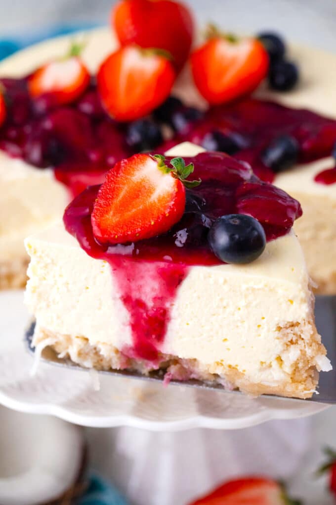 A slice of keto cheesecake on a serving spatula.