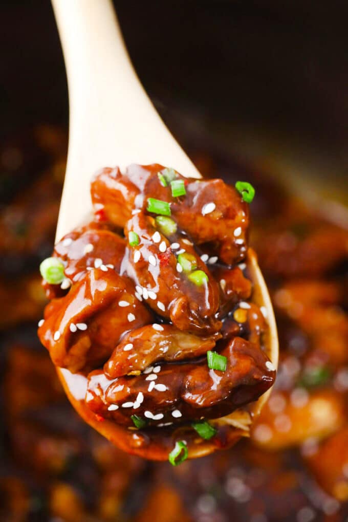 a large spoonful of perfectly cooked instant pot general tso chicken