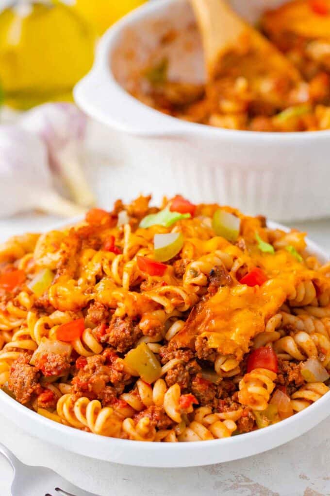 A plate of cheeseburger casserole made with pasta and ground beef.