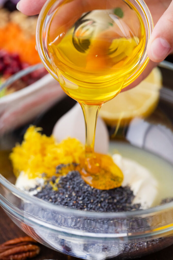 Making honey lemon poppy seed dressing.