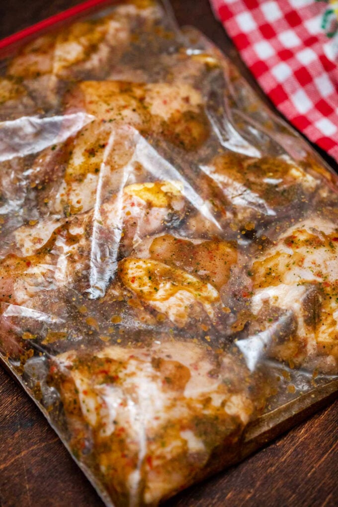 Chicken thighs and drumsticks in jerk marinade.