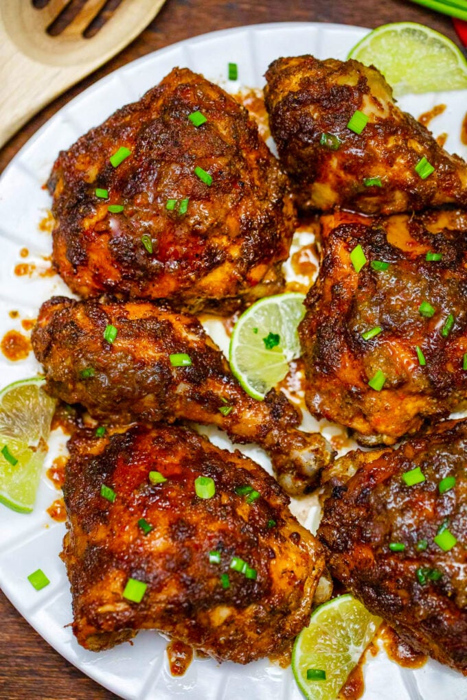 Jerk chicken thighs and drumsticks served over rice.