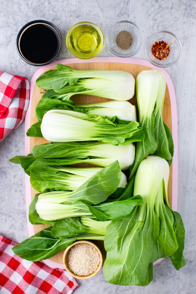 Overhead shot of oven roasted bok choy recipe ingredients on a white surface.