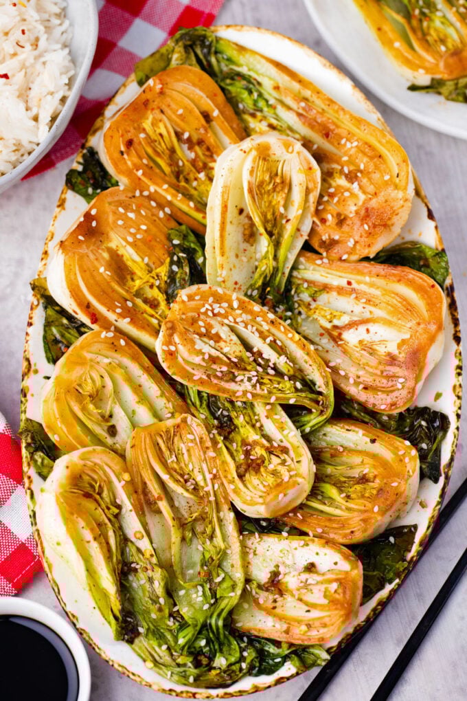 A serving plate of oven roasted bok choy.