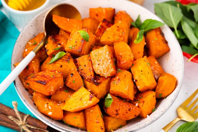 A bowl of brown sugar roasted sweet potato chunks.