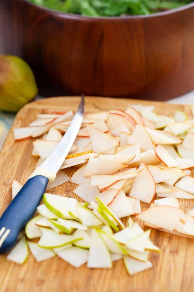 fresh sliced pears on a cutting board