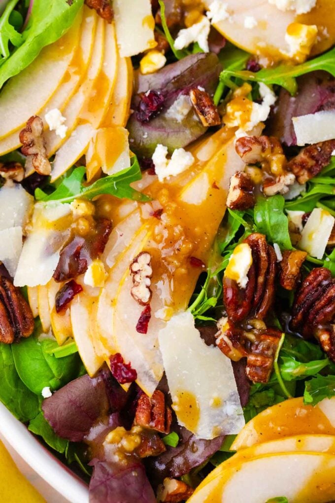 pear salad topped with crunchy pecans and parmesan cheese