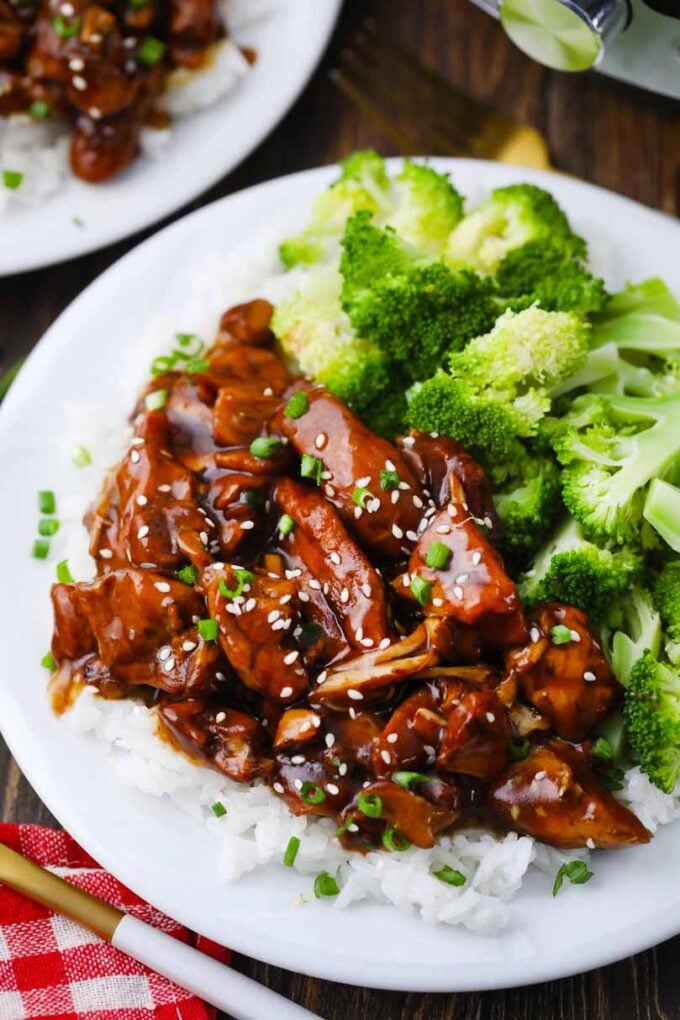 overhead shot of instant pot general tso chicken on top of rice and broccoli on the side