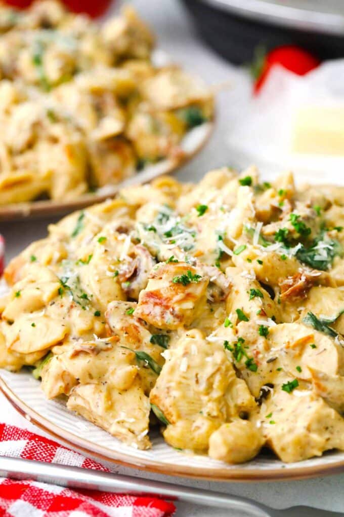 a plate of creamy and cheesy pressure cooker tuscan chicken pasta