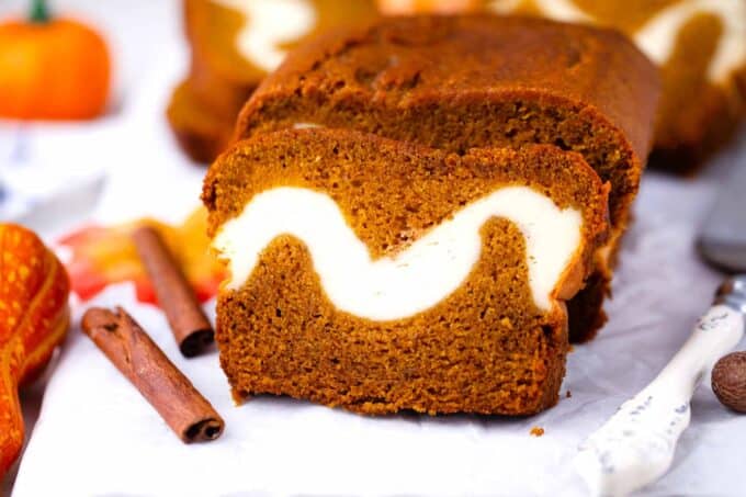 pumpkin bread with cream cheese filling on a serving board