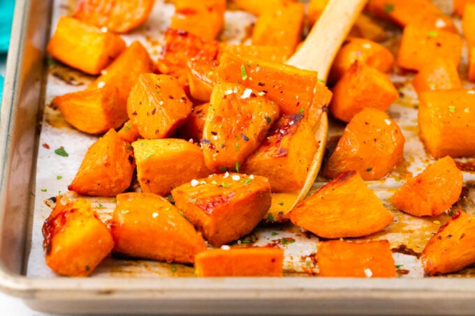 Roasted sweet potatoes on a baking sheet.