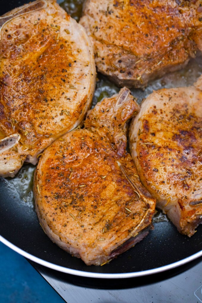 Searing bone-in pork chops.