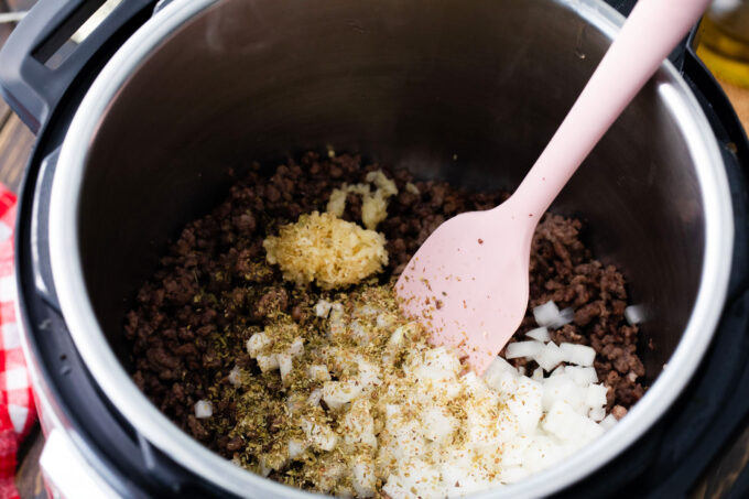 Searing ground sausage, onions, and garlic in the instant pot.