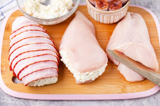 Wrapping chicken breasts in bacon and stuffing them with cream cheese and cheese mixture.