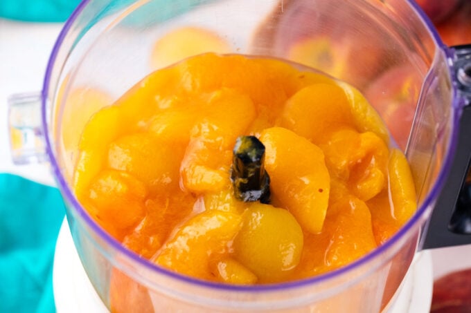 Sliced peaches in a blender.