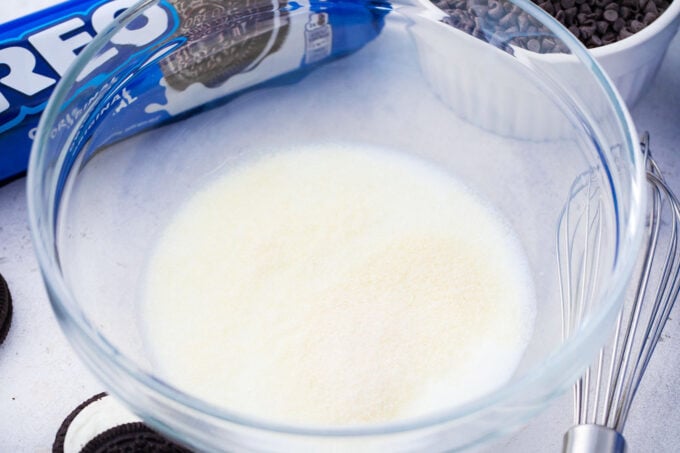 Blooming gelatin in milk.
