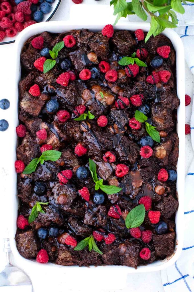 overhead shot of chocolate French toast casserole with blueberries and raspberries