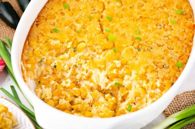 Homemade corn casserole on a white table.