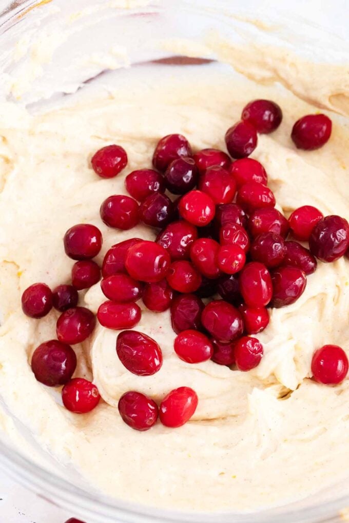 adding cranberries to muffin batter