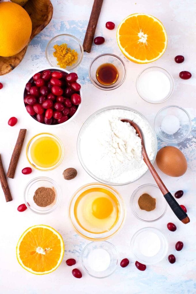 cranberry orange muffins ingredients in bowls on a table