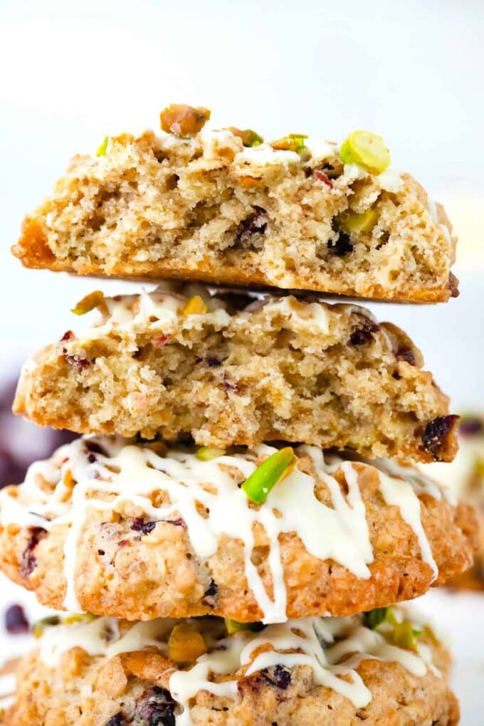 cranberry pistachio oatmeal cookies cut in half and stacked on top of each other