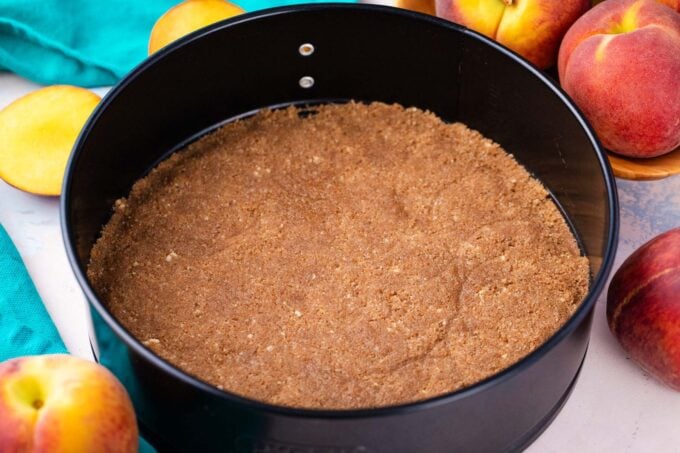 Cheesecake graham crust in a springform pan.
