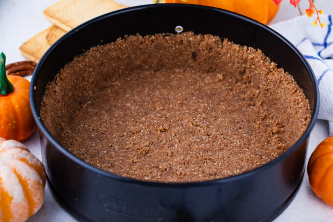 Graham cracker crust for a cheesecake.