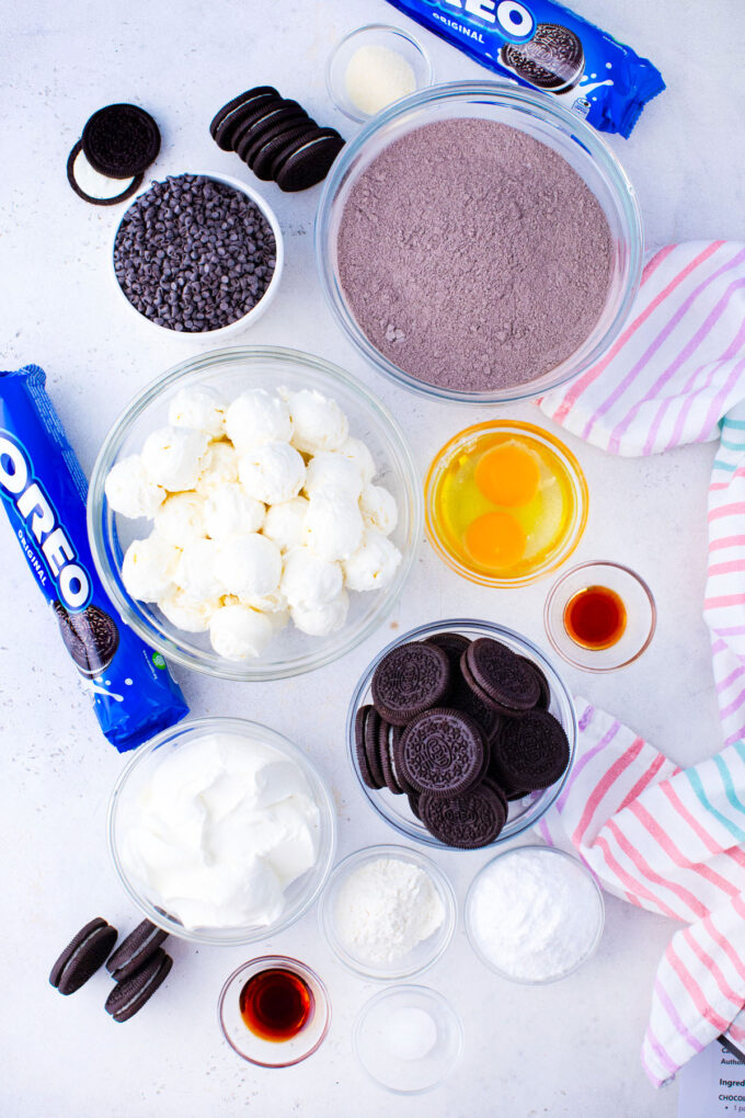 Overhead shot of dream extreme Oreo cake ingredients in bowls on a table.