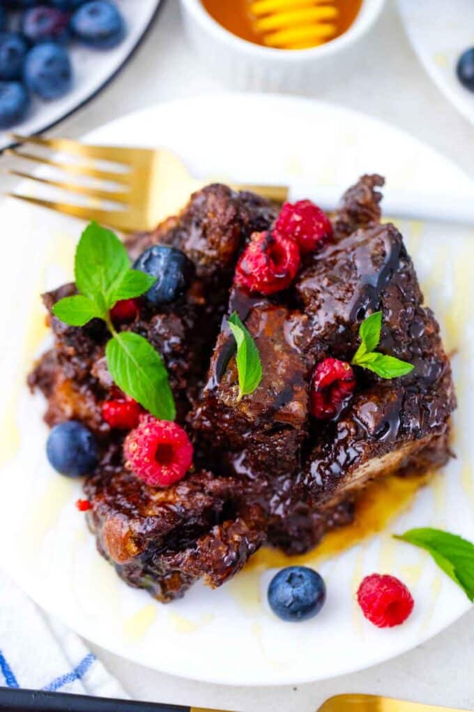 a slice of chocolate French toast casserole in maple syrup