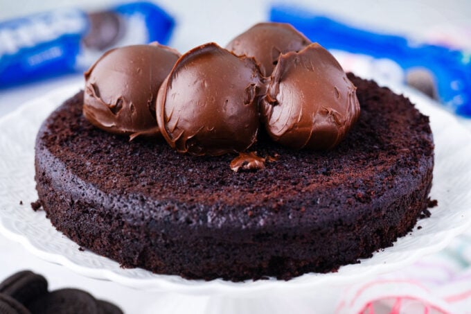 Chocolate ganache frosting on top of a chocolate cake layer.