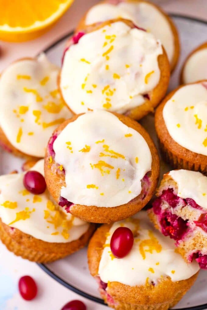 glazed cranberry orange muffins on a serving plate