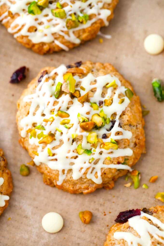 cranberry pistachio oatmeal cookies on parchment paper