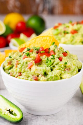 Mexican guacamole topped with chopped tomatoes, jalapenos, and onion.