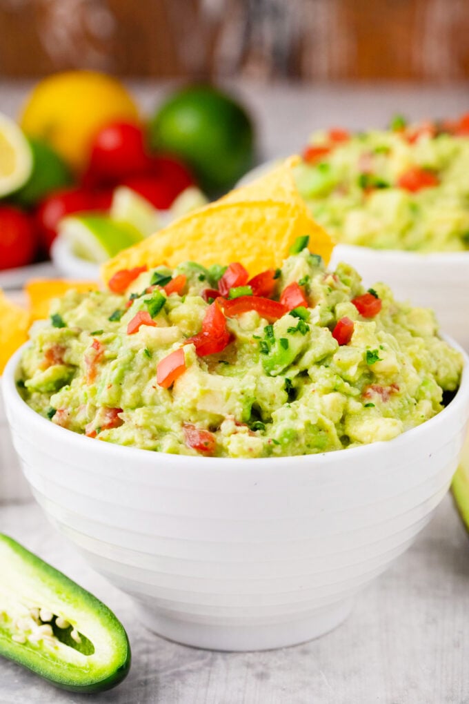 Mexican guacamole topped with chopped tomatoes, jalapenos, and onion.