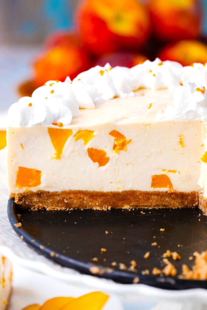 Sliced no bake peach cheesecake.