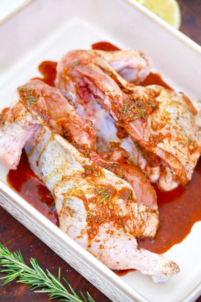 Marinating a whole chicken.