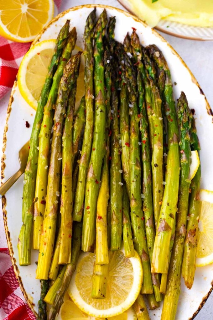 Overhead shot of a serving plate with oven roasted asparagus.