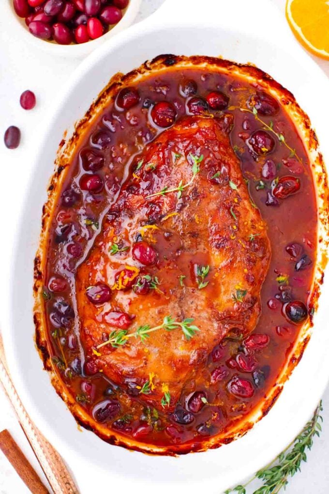 overhead shot of oven roasted cranberry orange turkey breast in a baking dish