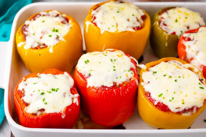 Red and yellow stuffed peppers.