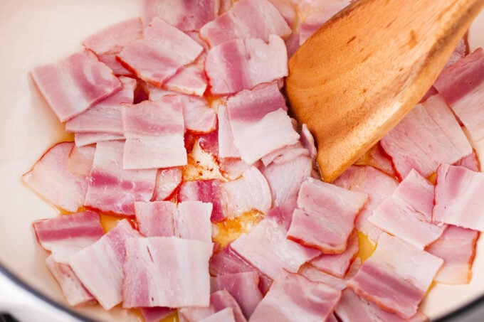 Cooking bacon pieces.