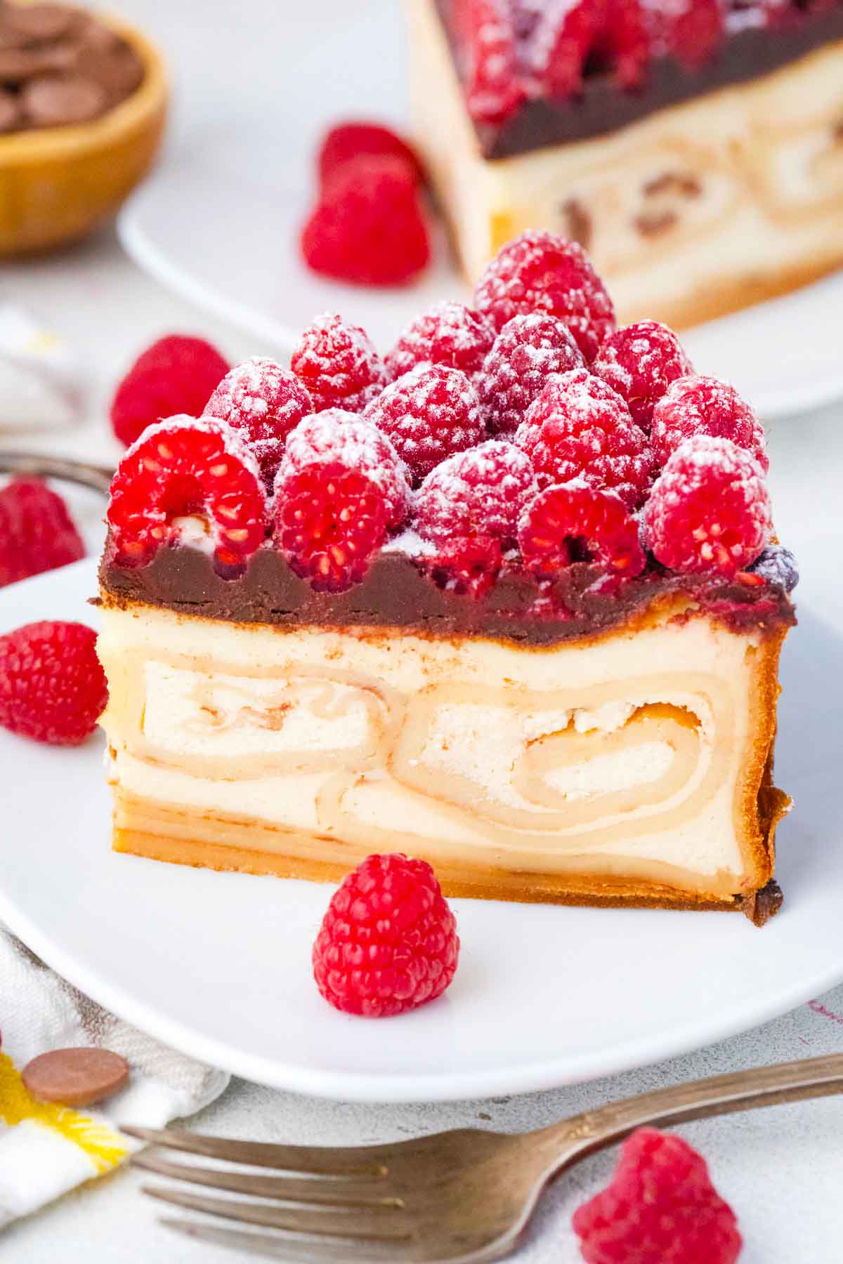 a slice of crepe stuffed new york cheesecake