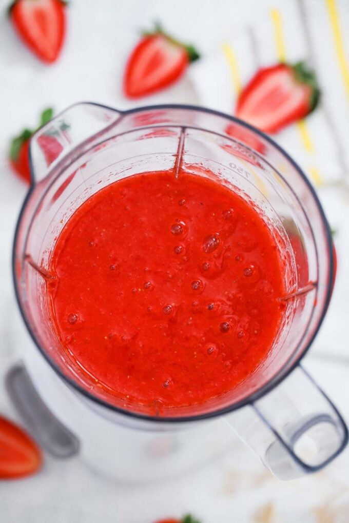 Blending strawberries and sugar.