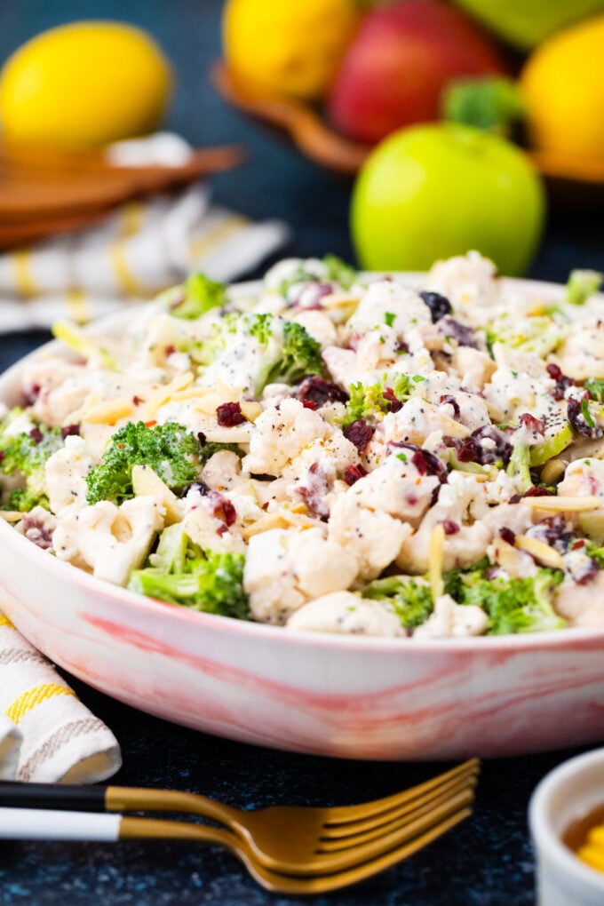 A bowl of crunchy broccoli cauliflower salad.