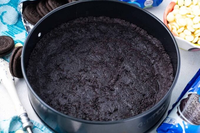 Cheesecake Oreo crust in a springform pan.