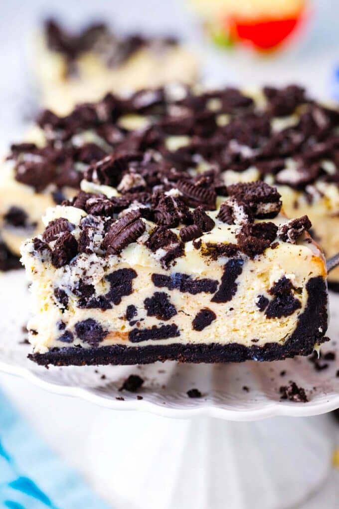 A slice of Instant Pot Oreo cheesecake on a serving spatula.