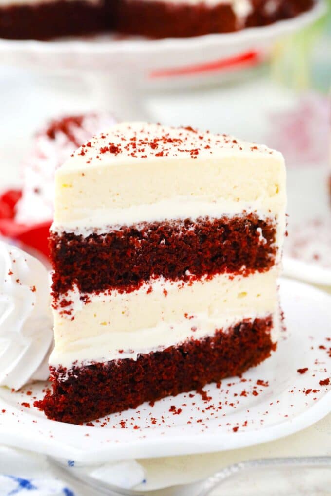 red velvet cheesecake cake copycat slice served with whipped cream